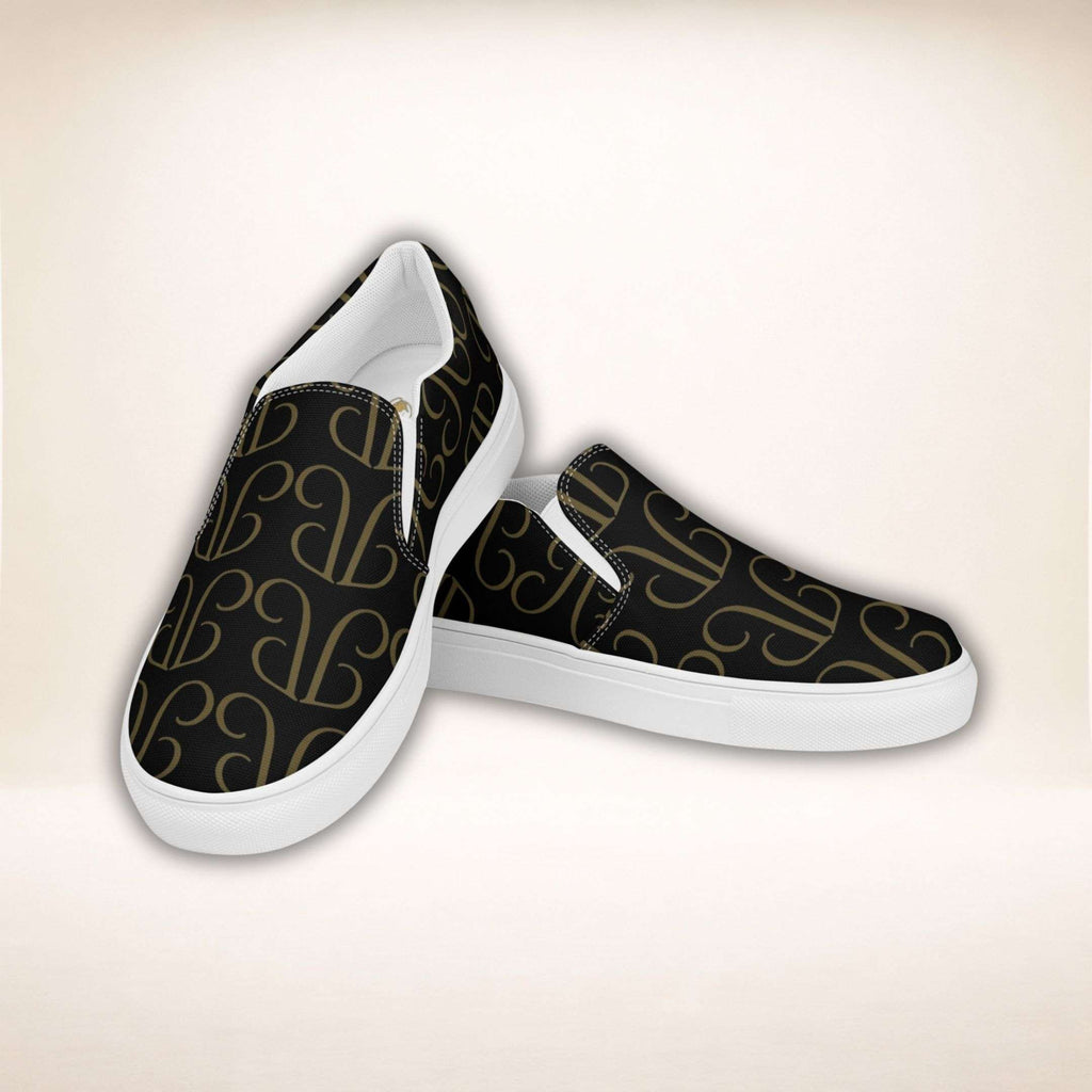 Schwarze Monogramm Slip-Ons mit goldenem Juliet-Muster und weißer Sohle